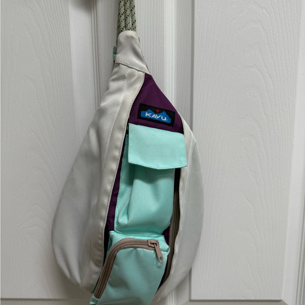 Kavu Sling Bag in white and Mint with Purple Accent.